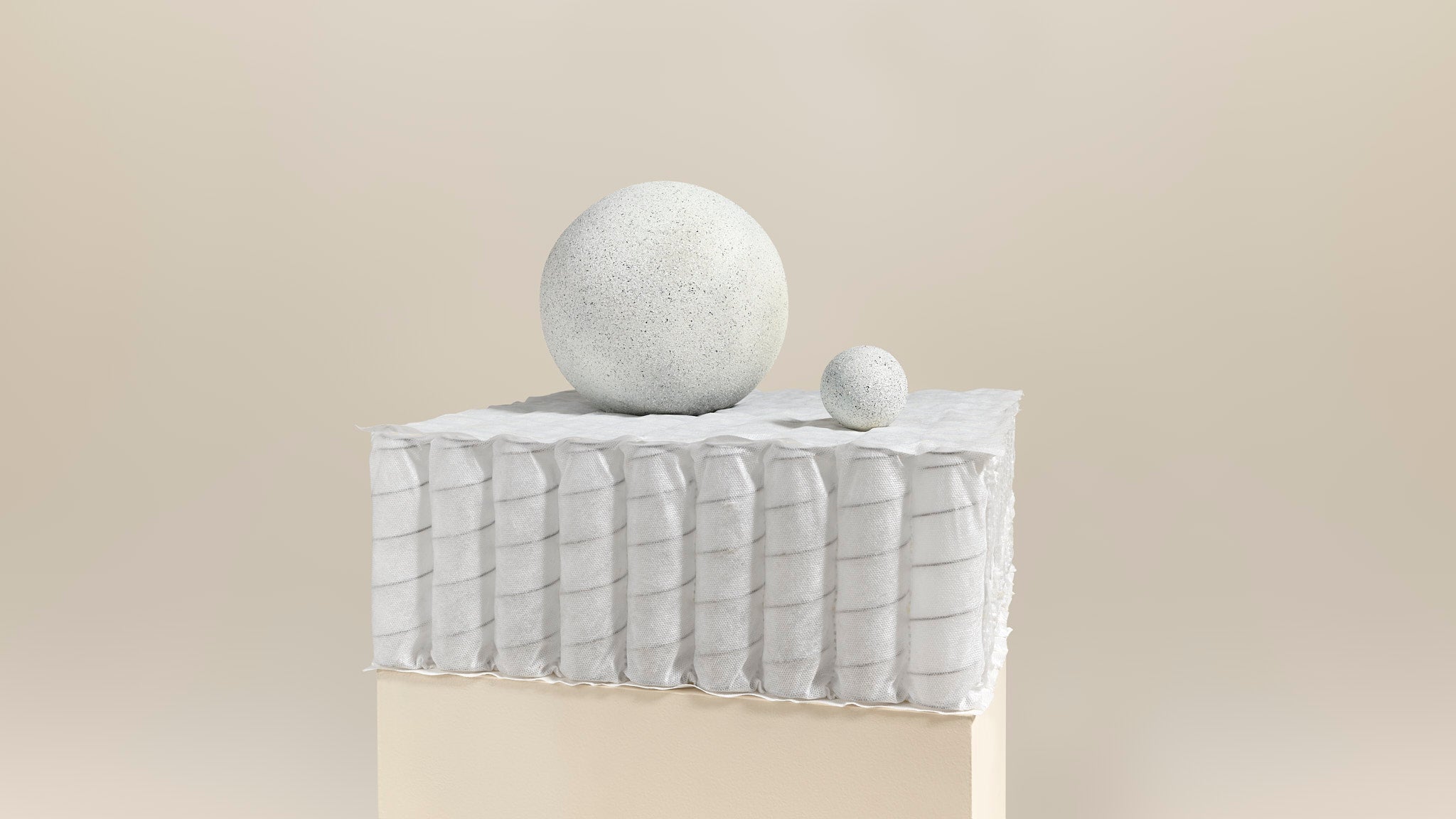 Ressorts ensachés Bonnuit sur fond neutre, offrant un soutien précis et durable au cœur du matelas